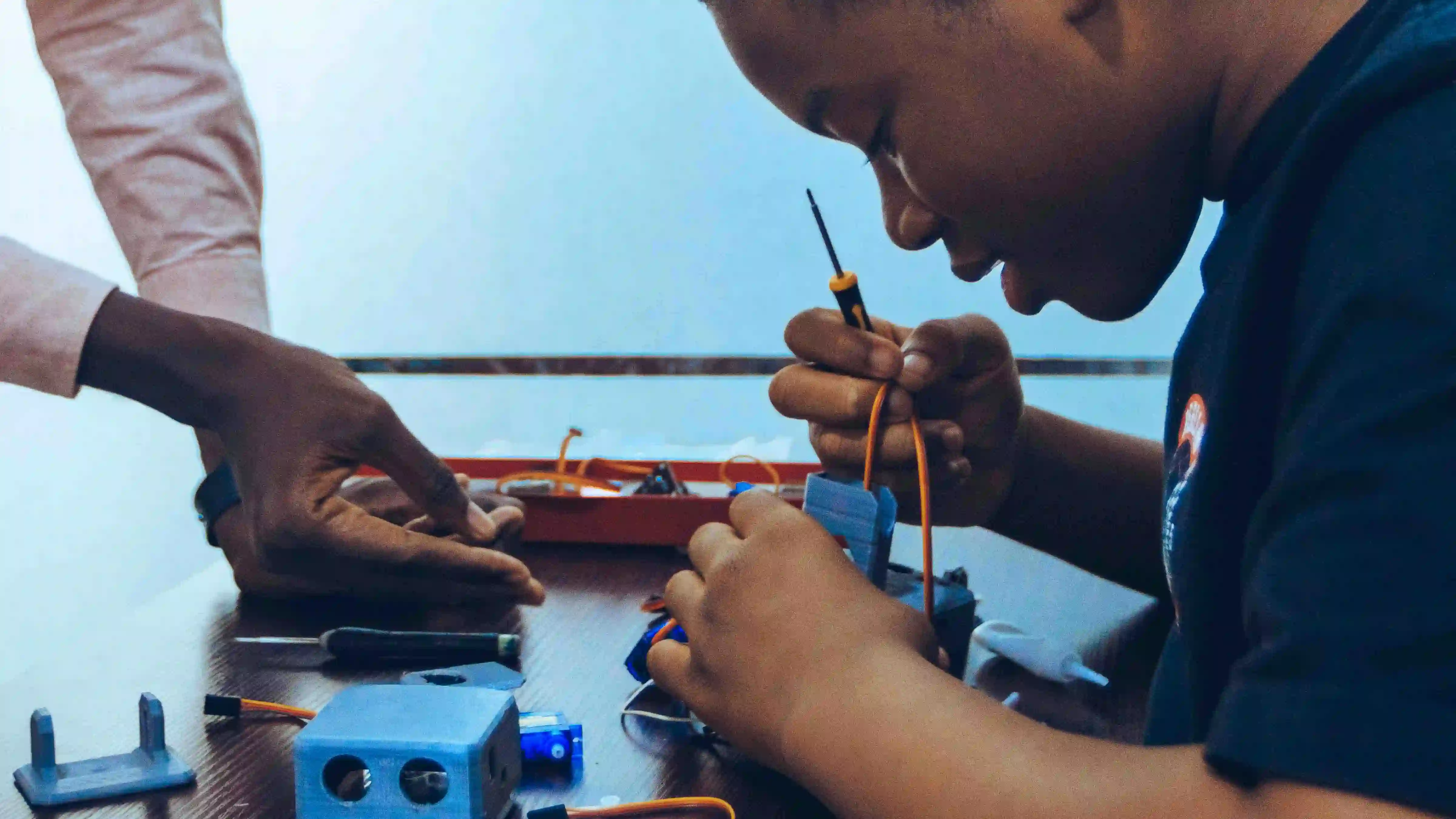 a-child-building-electronics